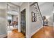 Hallway with hardwood floors leading to dining room and staircase to the second floor at 1525 Thomas Rd, Canton, GA 30115
