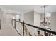 Upstairs hallway with beautiful chandelier lighting at 1525 Thomas Rd, Canton, GA 30115