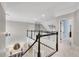 Upstairs landing with white wainscoting, dark wood trim, and neutral walls at 1525 Thomas Rd, Canton, GA 30115