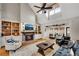 Inviting living room featuring vaulted ceilings, built-in shelving, and a cozy brick fireplace at 1525 Thomas Rd, Canton, GA 30115