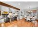 Open-concept living space with a fireplace and an open dining area, perfect for entertaining at 1525 Thomas Rd, Canton, GA 30115