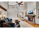 Spacious living room with a fireplace, tall ceilings, and a second-floor balcony at 1525 Thomas Rd, Canton, GA 30115