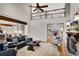 Open-concept living room with fireplace, a second-floor balcony, and open staircase at 1525 Thomas Rd, Canton, GA 30115