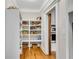 Walk-in pantry with custom shelving for organization, plus hardwood flooring at 1525 Thomas Rd, Canton, GA 30115