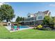 Inviting backyard pool area featuring a well-manicured lawn and luxurious lounge chairs at 1525 Thomas Rd, Canton, GA 30115