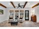 Cozy sunroom featuring brick floors, white shiplap walls, and a view of the backyard at 1525 Thomas Rd, Canton, GA 30115