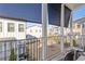 Balcony overlooking the community's townhome exteriors with shade roller at 1756 Morningtide Ne Ln, Atlanta, GA 30324