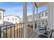 Relaxing balcony overlooking the community homes, with chairs and small table at 1756 Morningtide Ne Ln, Atlanta, GA 30324