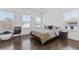 Serene bedroom with hardwood floors, multiple windows, and a comfortable bed at 1756 Morningtide Ne Ln, Atlanta, GA 30324