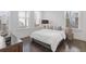 Bright bedroom with hardwood floors, white walls, and large windows at 1756 Morningtide Ne Ln, Atlanta, GA 30324