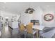 Bright dining area with modern lighting, hardwood floors, and an open floor plan to the kitchen at 1756 Morningtide Ne Ln, Atlanta, GA 30324
