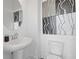 Stylish powder room with modern vanity, decorative mirror, and unique artwork at 1756 Morningtide Ne Ln, Atlanta, GA 30324
