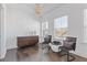 Sitting room featuring wood floors, two chairs, and a dresser at 1756 Morningtide Ne Ln, Atlanta, GA 30324