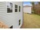 New construction home's backyard featuring fresh sod and lush landscape at 1857 Kingsmere Run Dr, Loganville, GA 30052