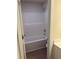Clean, white bathroom with a shower/tub combo and tiled floor at 1857 Kingsmere Run Dr, Loganville, GA 30052