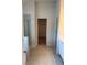 Tile-floored bathroom leading to shower and walk-in closet at 1857 Kingsmere Run Dr, Loganville, GA 30052