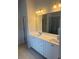 Bright bathroom with double vanity and a large mirror reflecting the walk-in shower at 1857 Kingsmere Run Dr, Loganville, GA 30052