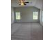 Spacious bedroom with plush carpet and ceiling fan at 1857 Kingsmere Run Dr, Loganville, GA 30052