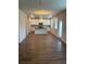 Bright, open kitchen features white cabinets, a center island, and hardwood floors at 1857 Kingsmere Run Dr, Loganville, GA 30052
