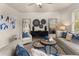 Bright living room featuring modern decor, hardwood flooring, and lots of light at 1857 Kingsmere Run Dr, Loganville, GA 30052