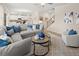 Open concept living room connects to kitchen and stairs to the upper level at 1857 Kingsmere Run Dr, Loganville, GA 30052