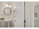 First floor powder room with a pedestal sink and decor at 1857 Kingsmere Run Dr, Loganville, GA 30052