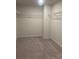 Large walk-in closet with carpeted flooring and wire shelving provides ample storage space at 1857 Kingsmere Run Dr, Loganville, GA 30052