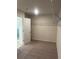 Generous walk-in closet with wire shelves and carpeted floor; an ideal organization space at 1857 Kingsmere Run Dr, Loganville, GA 30052