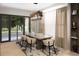 Dining room with a modern chandelier, neutral decor, and large glass doors leading to the outdoors at 4250 Carmain Ne Dr, Atlanta, GA 30342
