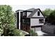 Contemporary two-story home featuring a two-car garage and a combination of modern and traditional design elements at 4250 Carmain Ne Dr, Atlanta, GA 30342