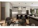 Open-concept kitchen featuring a marble island with seating, pendant lighting, and modern appliances at 4250 Carmain Ne Dr, Atlanta, GA 30342