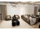Comfortable living room with stylish decor, including a modern sofa, armchairs, and contemporary lighting at 4250 Carmain Ne Dr, Atlanta, GA 30342