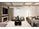 Bright living area with fireplace, built-in shelves and sleek modern furniture at 4250 Carmain Ne Dr, Atlanta, GA 30342