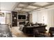 Open-concept living area boasts modern lighting, built-in shelving, and sleek fireplace at 4250 Carmain Ne Dr, Atlanta, GA 30342