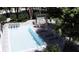 Aerial view of backyard pool with adjacent outdoor kitchen and dining area at 4250 Carmain Ne Dr, Atlanta, GA 30342