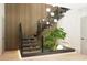 Modern staircase with ambient lighting, featuring a unique indoor garden beneath, enhancing the home's aesthetic at 4250 Carmain Ne Dr, Atlanta, GA 30342