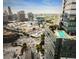 Stunning aerial view of the city skyline featuring a modern building with a rooftop pool at 3630 Peachtree Ne Rd # 1809, Atlanta, GA 30326
