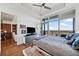 Bright bedroom features hardwood floors, a large window with a view, and access to an en-suite bathroom at 3630 Peachtree Ne Rd # 1809, Atlanta, GA 30326