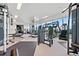Well-lit gym with modern equipment, mirrored walls, and large windows with natural light at 3630 Peachtree Ne Rd # 1809, Atlanta, GA 30326