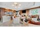 Elegant living room with fireplace, built-in shelving, stylish furniture, and a modern chandelier at 3630 Peachtree Ne Rd # 1809, Atlanta, GA 30326