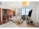 Bright, modern living room with a large window with a view and white couches at 3630 Peachtree Ne Rd # 1809, Atlanta, GA 30326