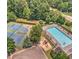 Aerial view of community amenities featuring tennis courts, a pool, and a playground at 266 Valley Xing, Canton, GA 30114