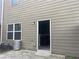 Rear view of home, showing access door and window at 266 Valley Xing, Canton, GA 30114