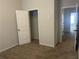 Bedroom featuring neutral carpet, a closet, and a view of the hallway at 266 Valley Xing, Canton, GA 30114