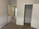 Bedroom featuring neutral carpet, a closet, and a view of the hallway at 266 Valley Xing, Canton, GA 30114