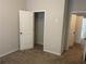 Bedroom featuring neutral carpet, a closet, and a view of the hallway at 266 Valley Xing, Canton, GA 30114