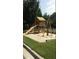 Community playground with a wooden playset featuring a slide and swings for outdoor fun at 266 Valley Xing, Canton, GA 30114