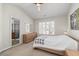 Bright bedroom with a ceiling fan, a window with shutters and carpeted floor at 3782 Chattahoochee Summit Se Dr, Atlanta, GA 30339