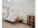 Bedroom featuring a white futon, small bookshelf and a window at 3782 Chattahoochee Summit Se Dr, Atlanta, GA 30339