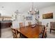 Open dining room showcasing kitchen with wood cabinets and island at 3782 Chattahoochee Summit Se Dr, Atlanta, GA 30339